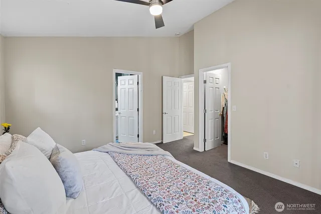 a bedroom with a bed and a walk in closet