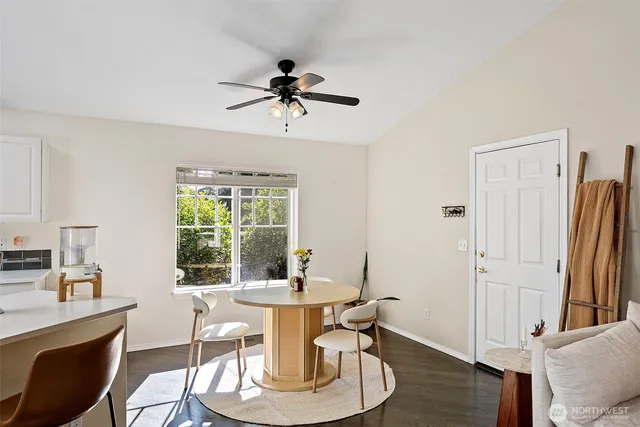 a view of a dining room with furniture window and wooden floor