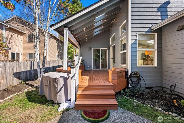 a view of a patio with couches chairs and a potted plant