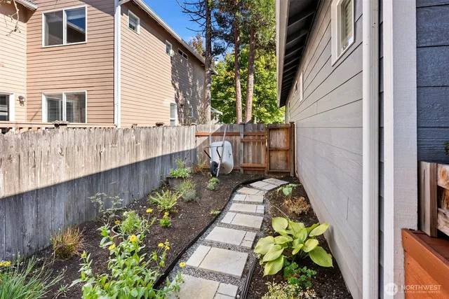 a view of a pathway with flower pots