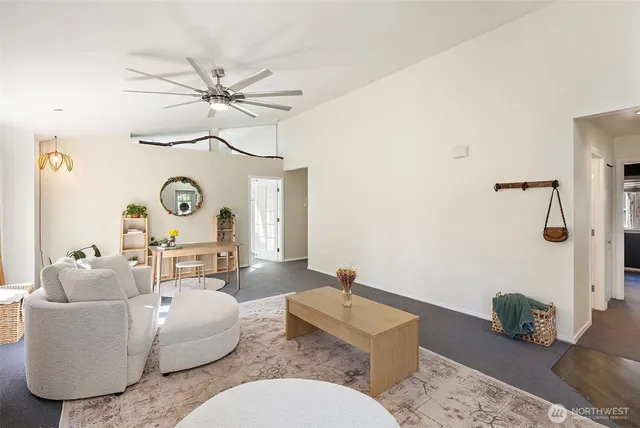 a living room with furniture and a clock