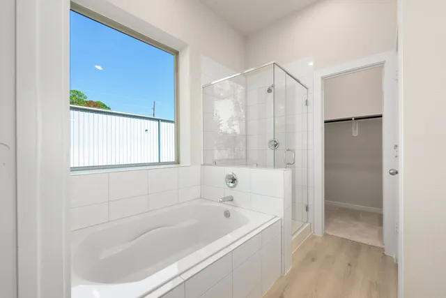 a bathroom with a bathtub and a shower