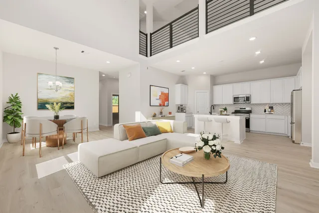 a living room with furniture and kitchen view