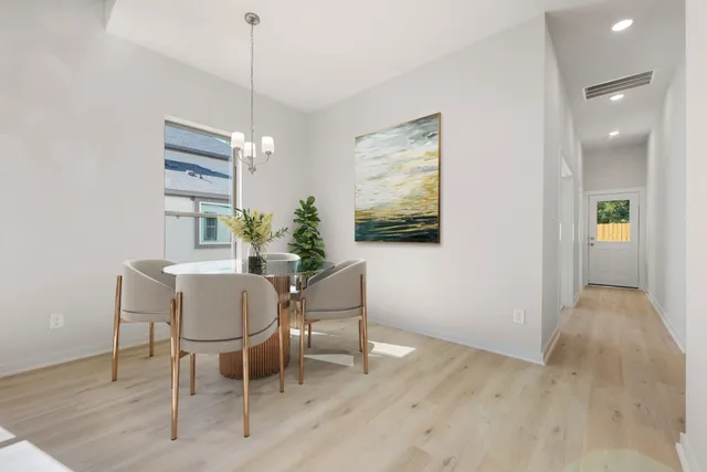 a dining room with furniture and window
