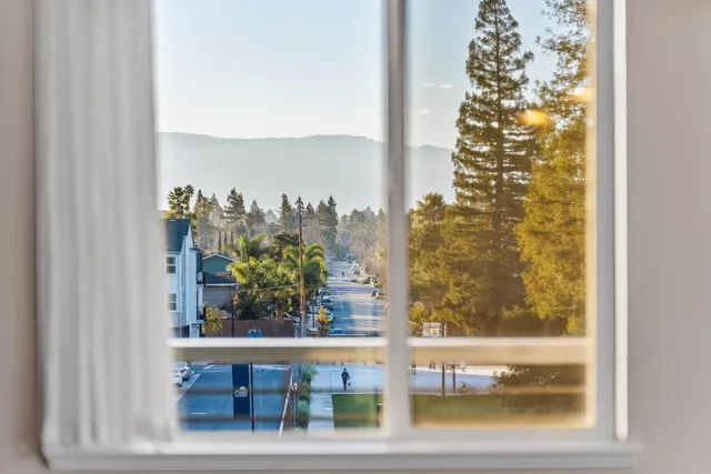 a living room with furniture kitchen and a table