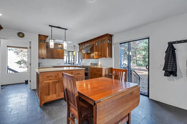 a room with furniture a flat screen tv and a window