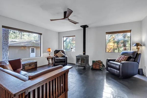 a kitchen with stainless steel appliances granite countertop a kitchen island a stove a sink a table and chairs