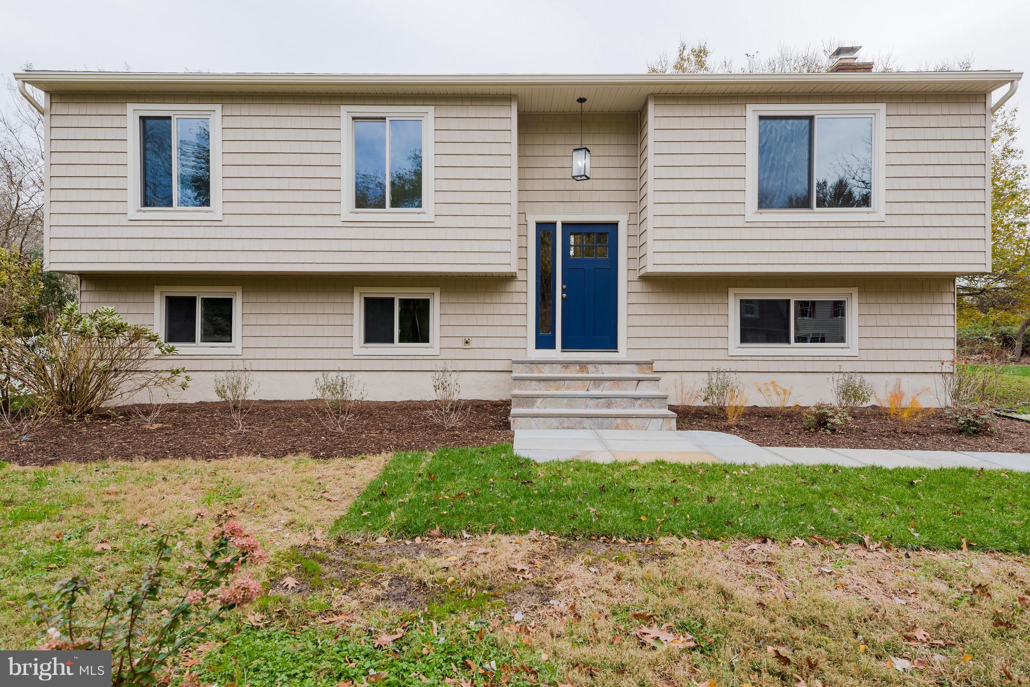 627 Truxton Road Annapolis, MD 21409 - Photo 2 of 48 a front view of a house with a yard and garage
