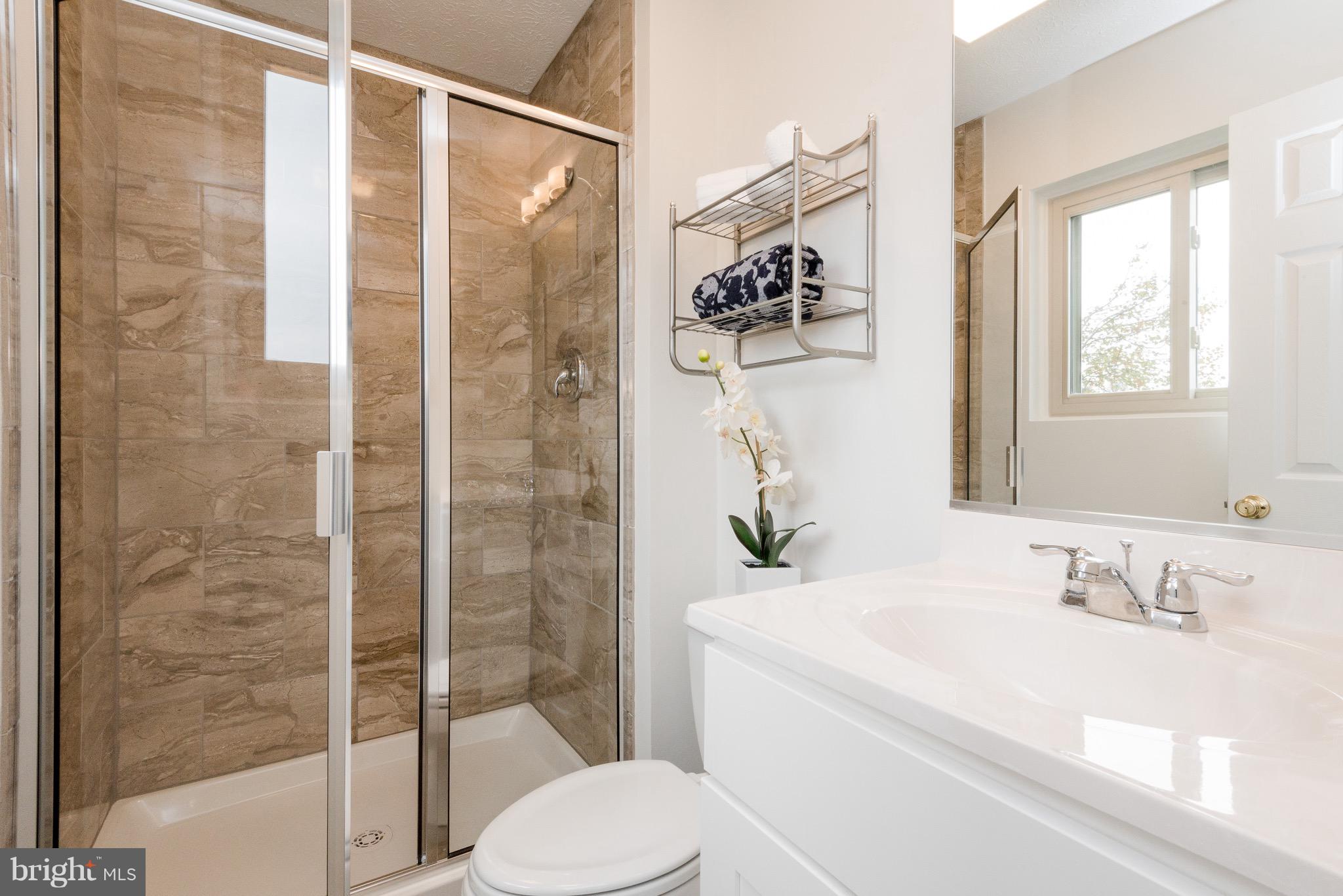 627 Truxton Road Annapolis, MD 21409 - Photo 14 of 48 a bathroom with a sink toilet and shower