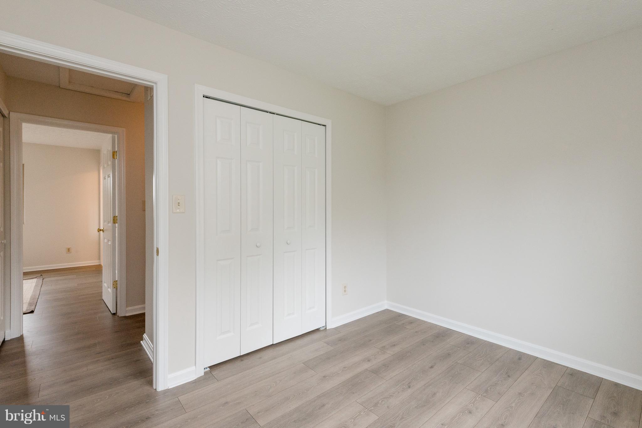 627 Truxton Road Annapolis, MD 21409 - Photo 18 of 48 a view of an empty room with wooden floor and closet