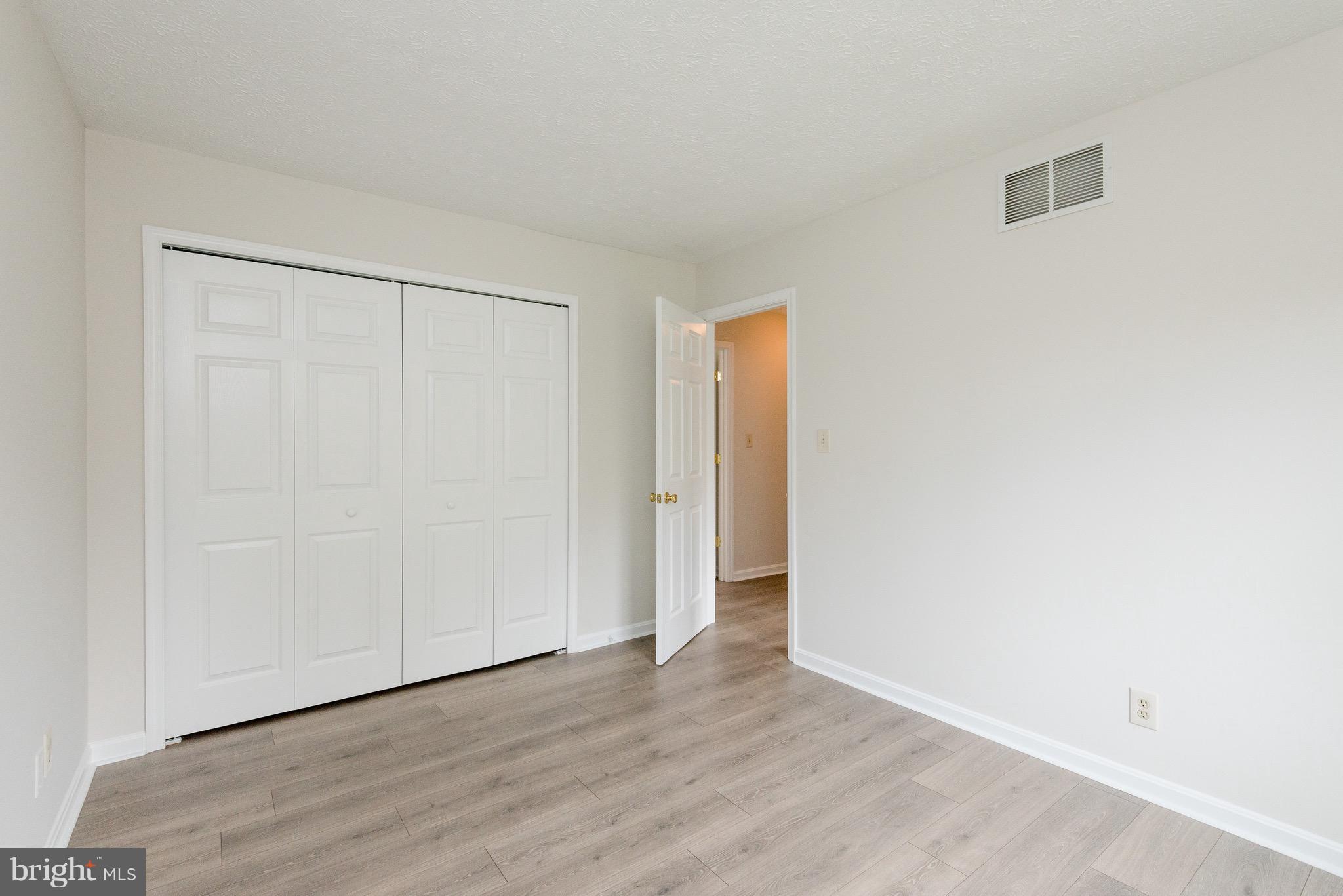 627 Truxton Road Annapolis, MD 21409 - Photo 20 of 48 a view of an empty room with wooden floor