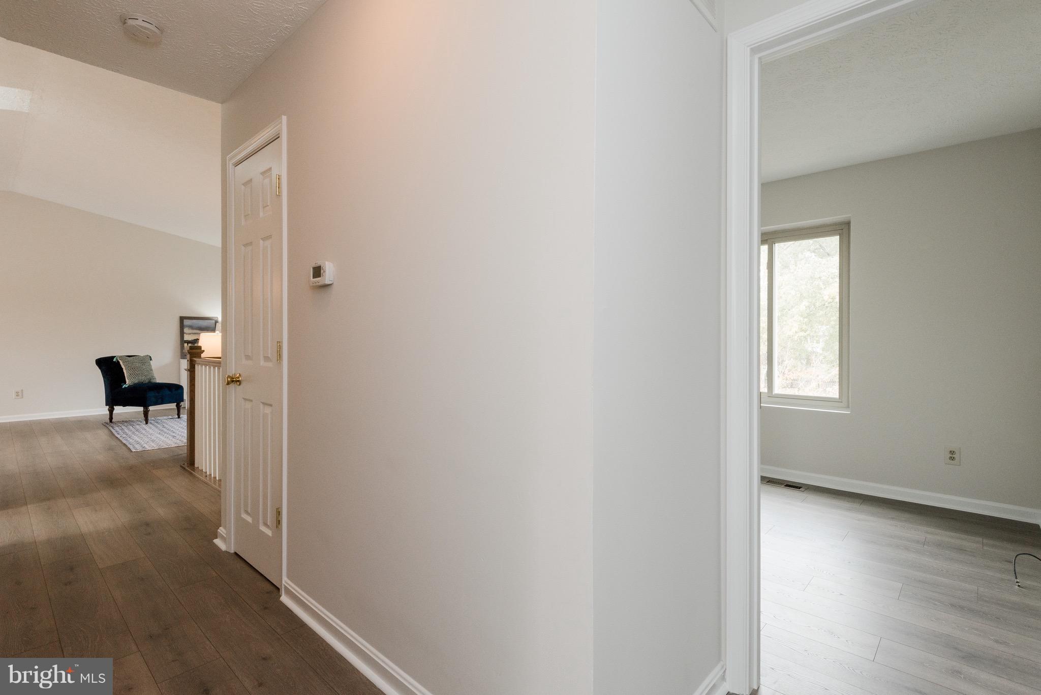 627 Truxton Road Annapolis, MD 21409 - Photo 22 of 48 a view of a livingroom with wooden floor and a window