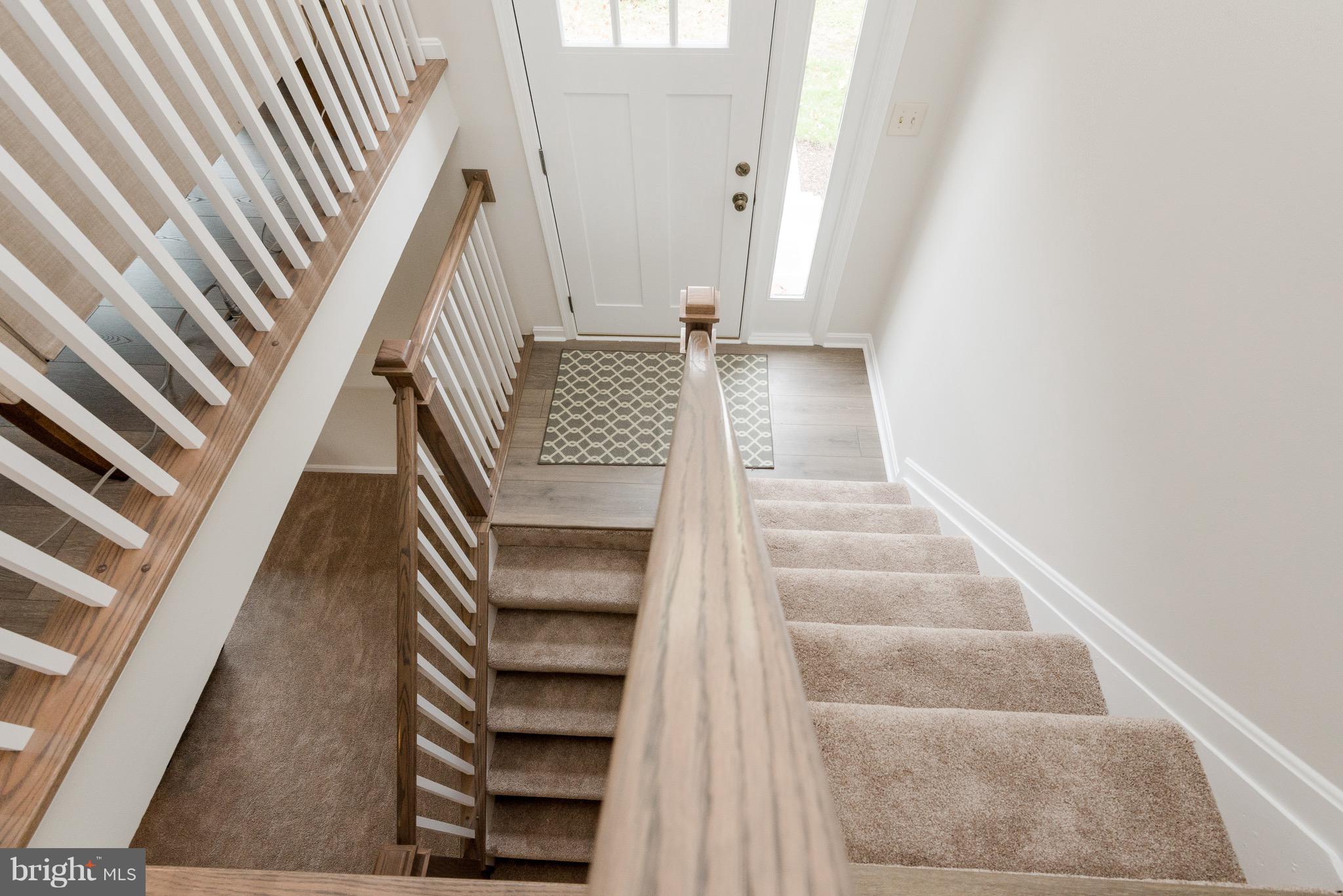 627 Truxton Road Annapolis, MD 21409 - Photo 23 of 48 a view of staircase with white walls and a window