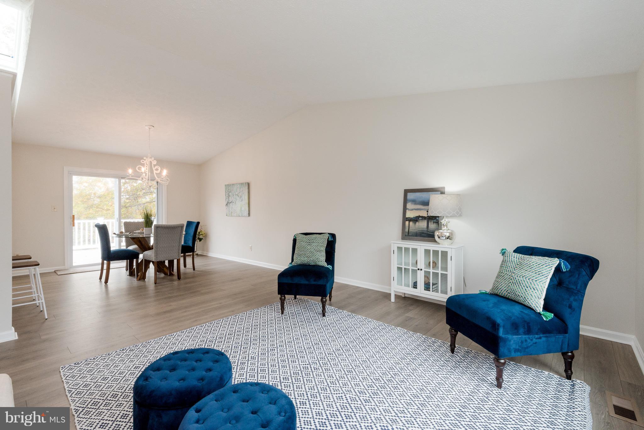 627 Truxton Road Annapolis, MD 21409 - Photo 31 of 48 a living room with furniture and a chair