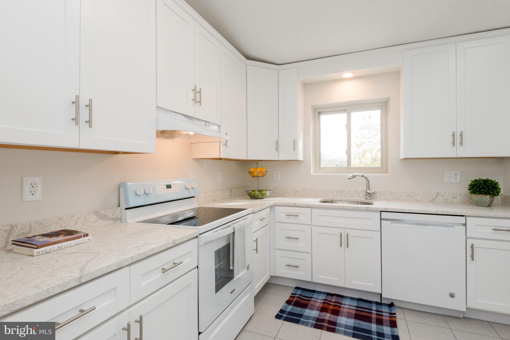 627 Truxton Road Annapolis, MD 21409 - Photo 33 of 48 a kitchen with cabinets appliances a sink and a window