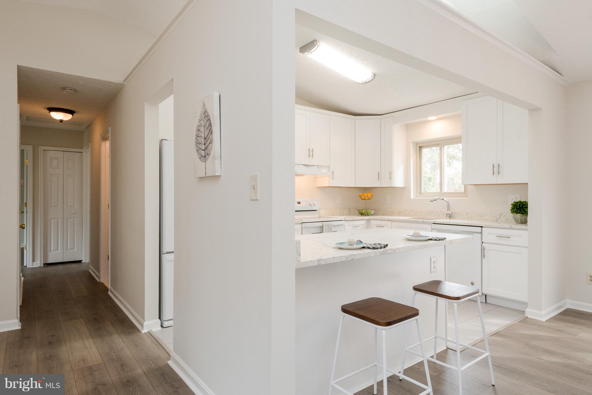 627 Truxton Road Annapolis, MD 21409 - Photo 34 of 48 a kitchen with white cabinets and appliances