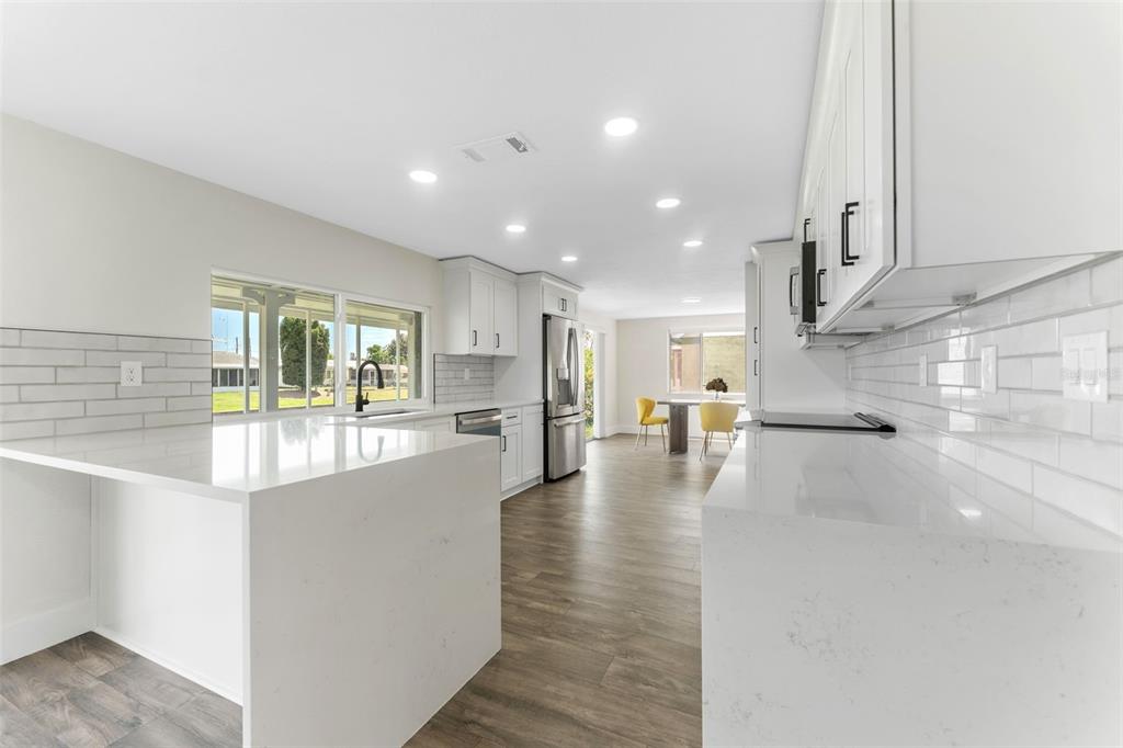 4016 Grayton Drive New Port Richey, FL 34652 - Photo 11 of 40 a view of an entryway of a kitchen and kitchen with windows