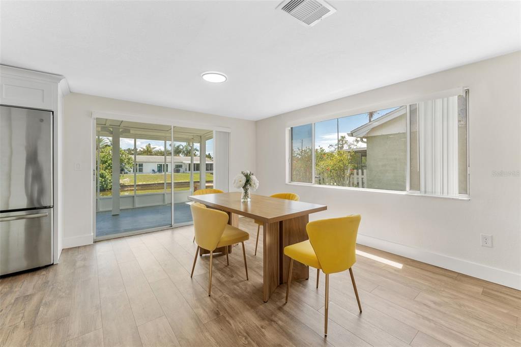 4016 Grayton Drive New Port Richey, FL 34652 - Photo 15 of 40 a dining room with furniture and wooden floor