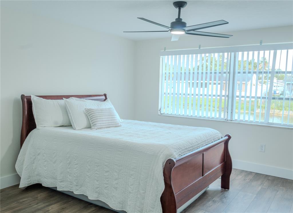 4016 Grayton Drive New Port Richey, FL 34652 - Photo 17 of 40 a bed sitting in a bedroom next to a window