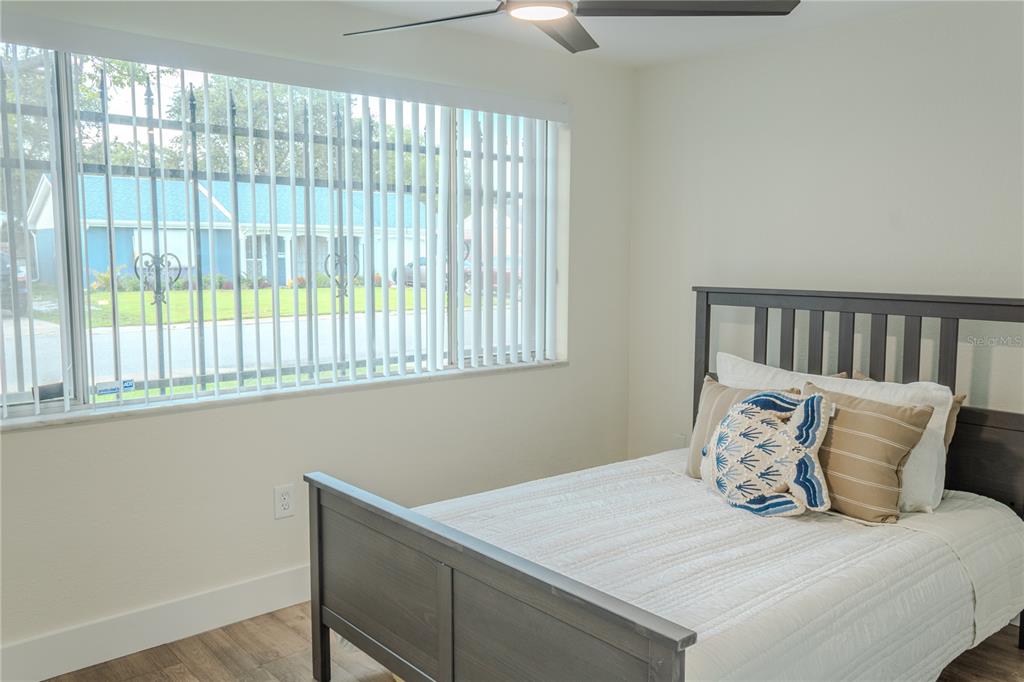 4016 Grayton Drive New Port Richey, FL 34652 - Photo 20 of 40 a bedroom with a bed and a window