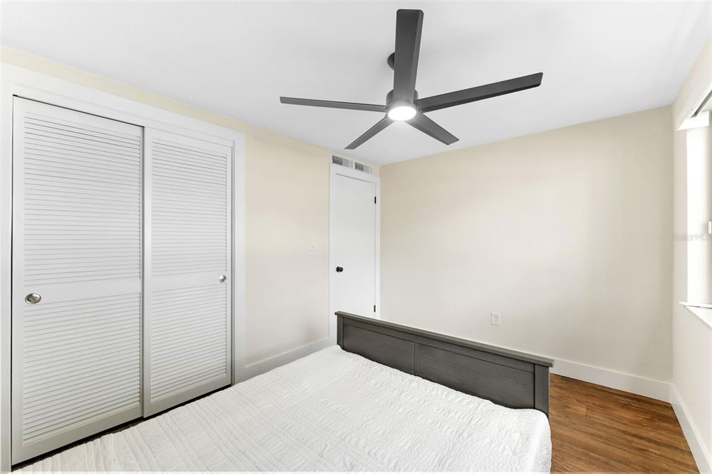 4016 Grayton Drive New Port Richey, FL 34652 - Photo 21 of 40 a bedroom with a bed and a ceiling fan