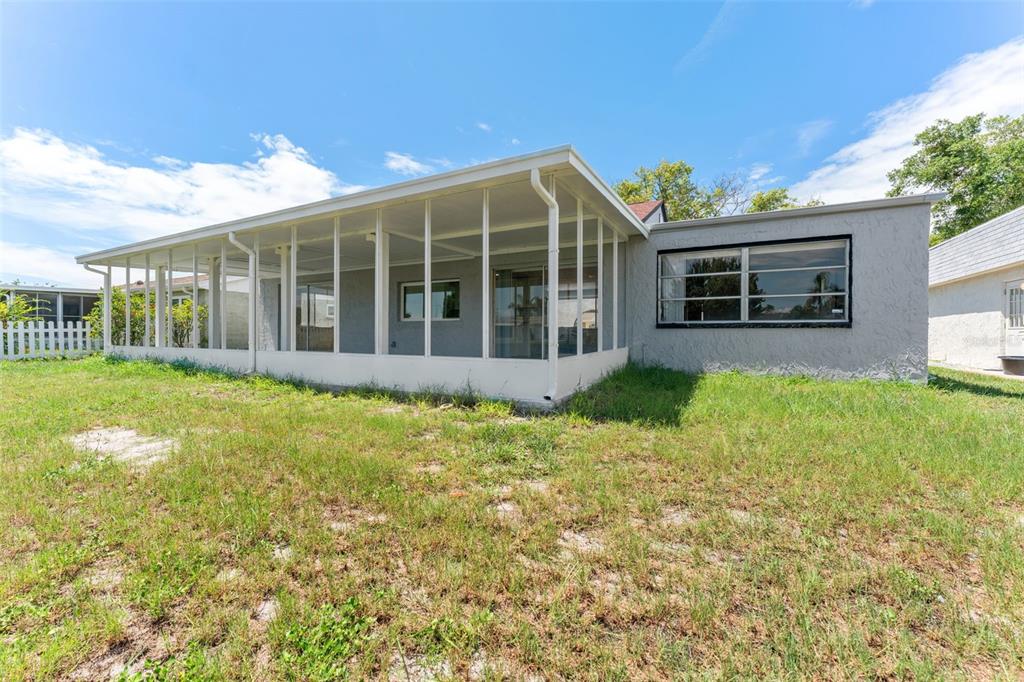 4016 Grayton Drive New Port Richey, FL 34652 - Photo 31 of 40 a view of a house with backyard and garden