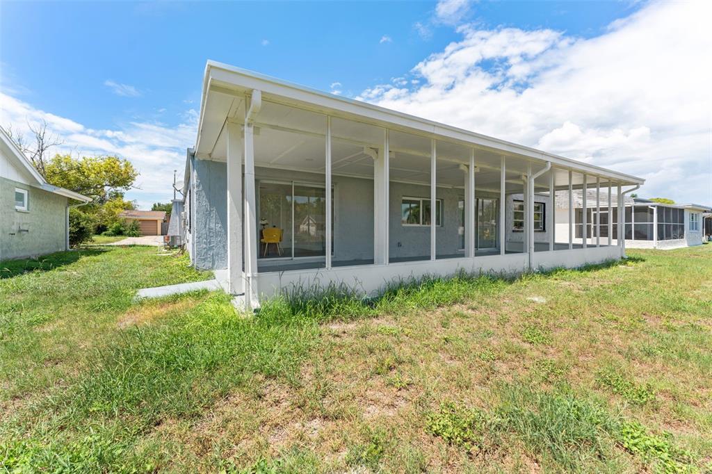 4016 Grayton Drive New Port Richey, FL 34652 - Photo 33 of 40 a view of a house with backyard and garden