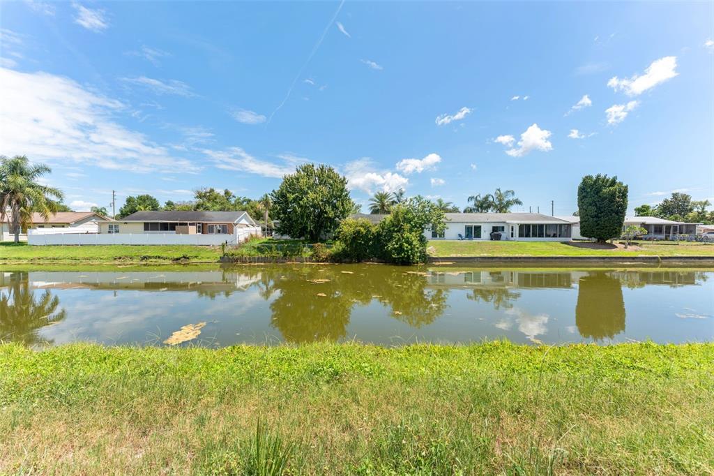 4016 Grayton Drive New Port Richey, FL 34652 - Photo 34 of 40 a view of a lake with a big yard