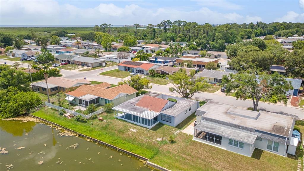 4016 Grayton Drive New Port Richey, FL 34652 - Photo 36 of 40 an aerial view of residential houses with outdoor space and swimming pool