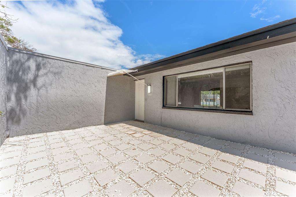 4016 Grayton Drive New Port Richey, FL 34652 - Photo 5 of 40 a house with trees in the background