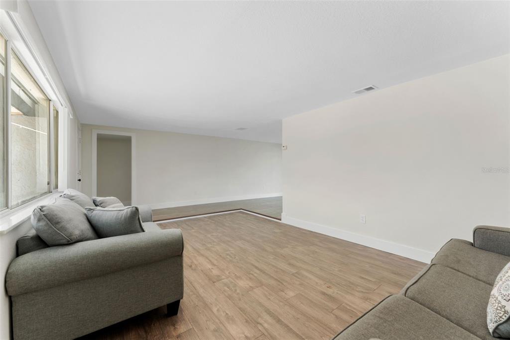 4016 Grayton Drive New Port Richey, FL 34652 - Photo 8 of 40 a living room with furniture and a couch