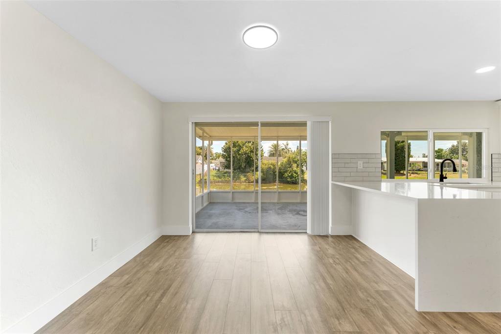 4016 Grayton Drive New Port Richey, FL 34652 - Photo 9 of 40 wooden floor in an empty room with a window