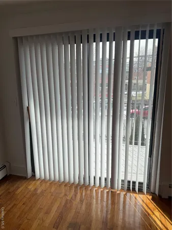 a view of outdoor space with wooden floor