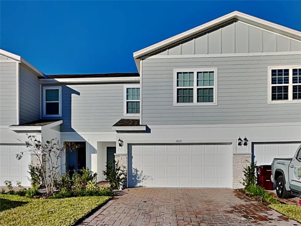 a front view of a house with garage