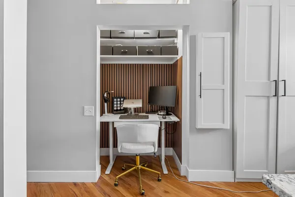 a workspace with furniture and wooden floor