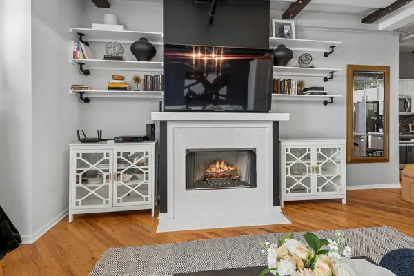 a living room with furniture and a fireplace