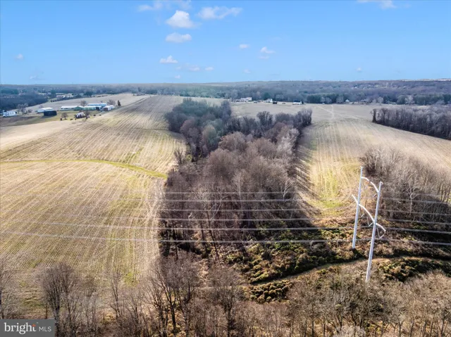 a view of a dry yard with mountains