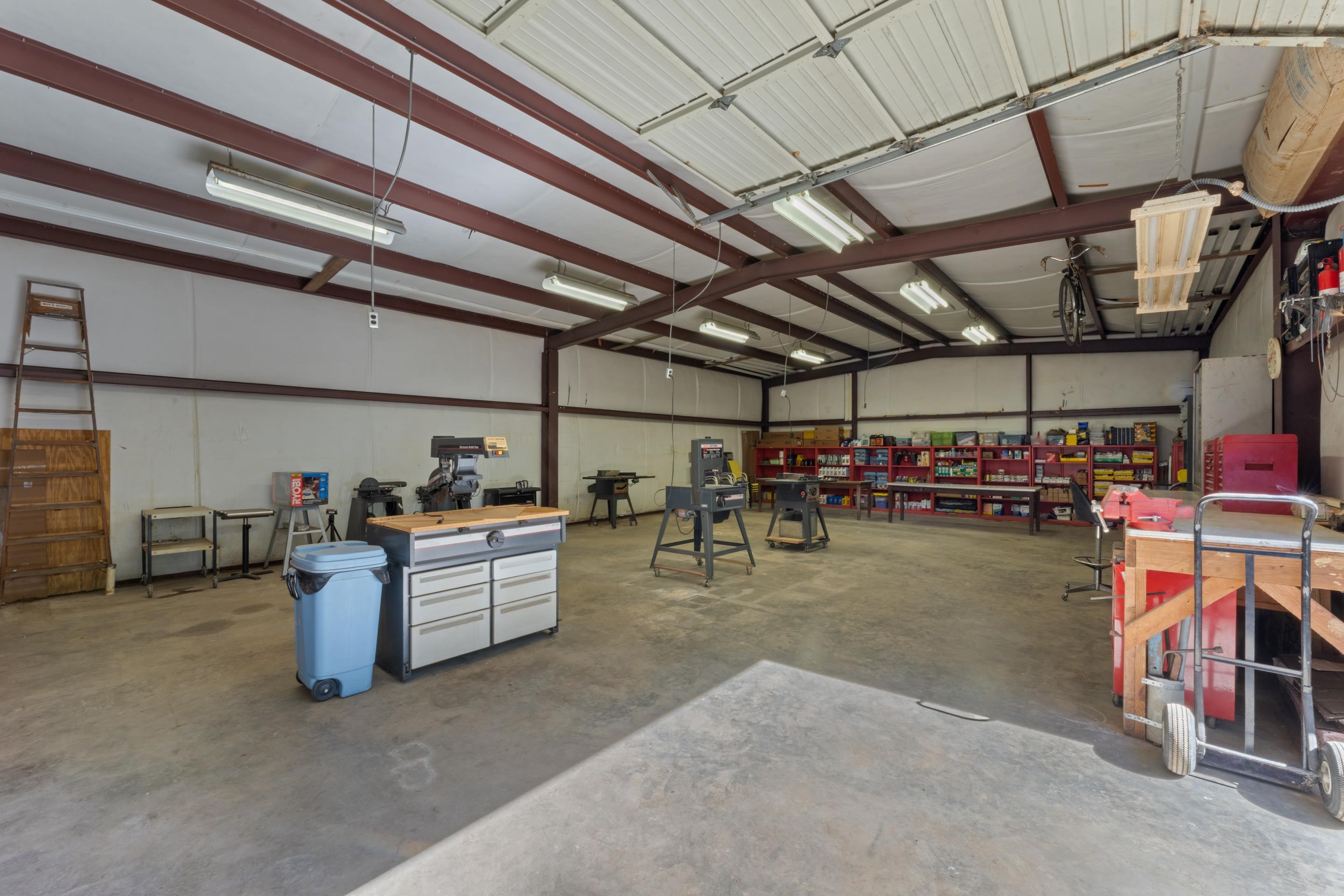 650 Blain Road Rossville, TN 38066 - Photo 24 of 26 This expansive shop features durable concrete floors and extensive lighting, creating an ideal space for projects, vehicles, or storage. Its size and functionality make it a standout feature of the property.