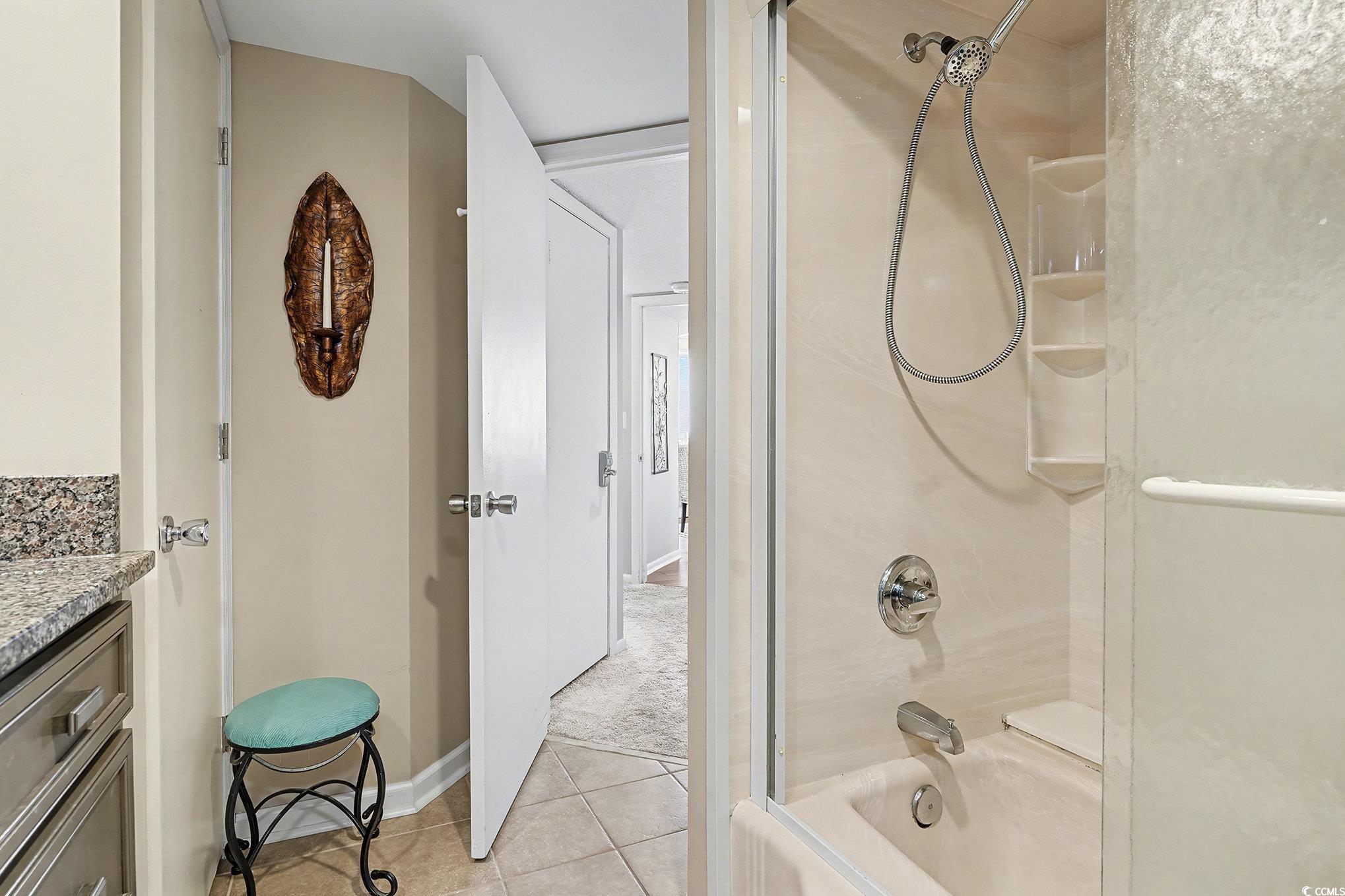 9650 Shore Drive, Unit 1507 Myrtle Beach, SC 29572 - Photo 15 of 39 Full bathroom with vanity, shower / washtub combination, light tile patterned floors, and light colored carpet