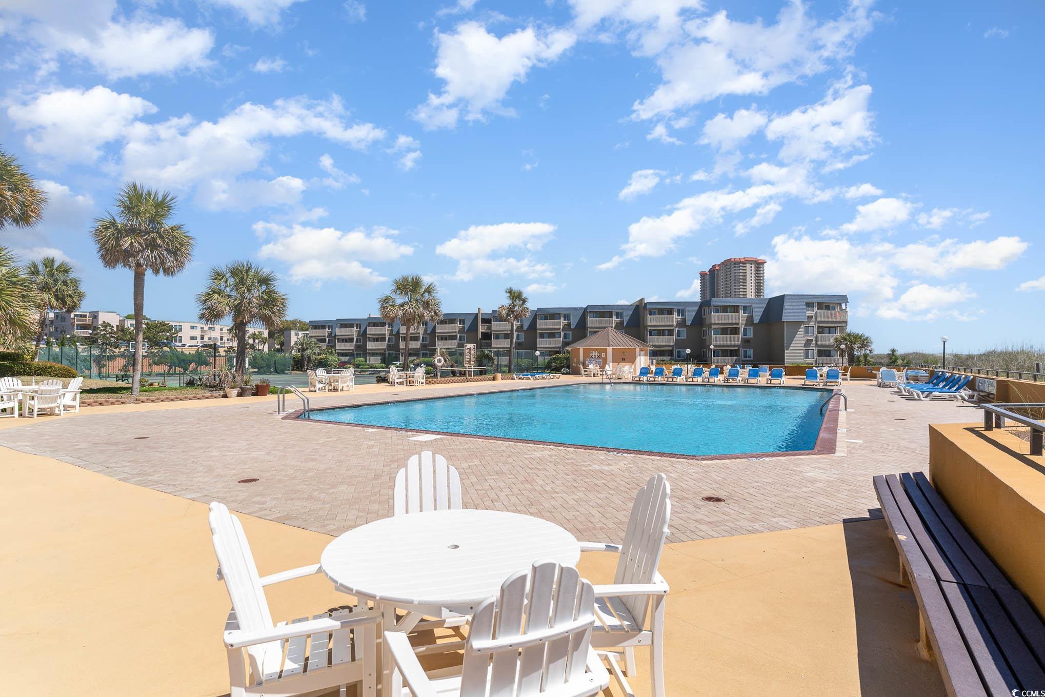 9650 Shore Drive, Unit 1507 Myrtle Beach, SC 29572 - Photo 30 of 39 Community pool featuring a patio