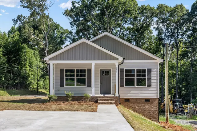 a house with trees in the background
