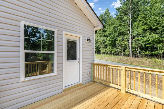 a view of a balcony with wooden floor
