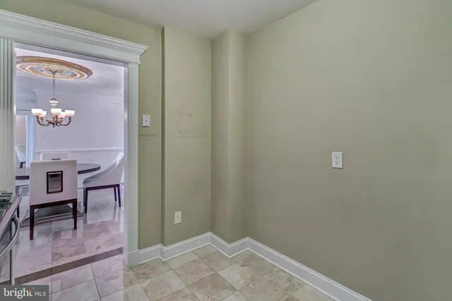 a kitchen with granite countertop a sink stove and cabinets