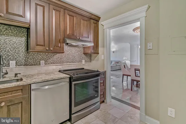 a dining room with furniture and chandelier