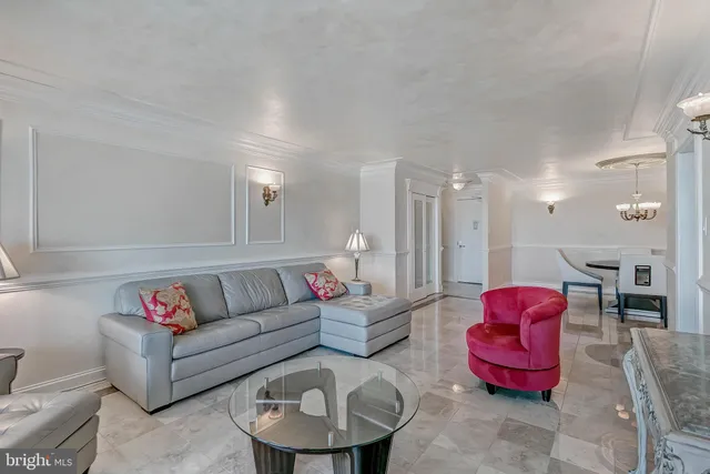 a living room with furniture a rug and a window