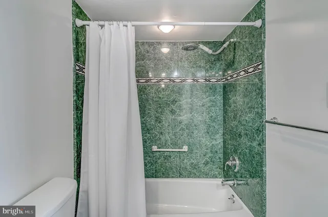 a bedroom with a bed and a closet