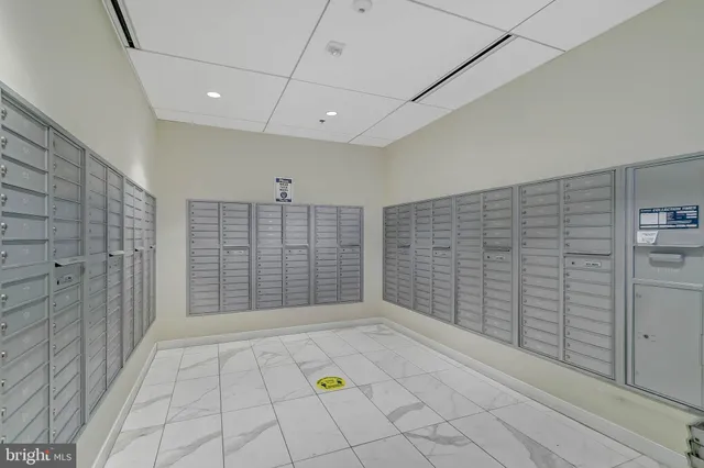 a kitchen with granite countertop a sink stove and refrigerator