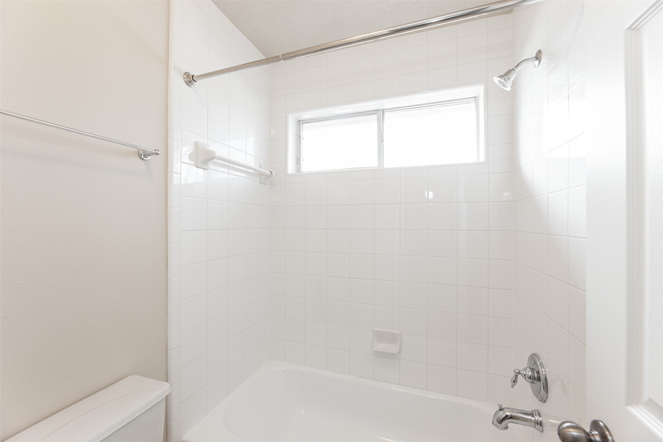 25919 Pebble Terrane Lane Katy, TX 77494 - Photo 27 of 28 a bathroom with a bathtub and a shower