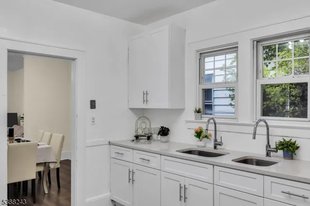 a view of a workspace with furniture and wooden floor