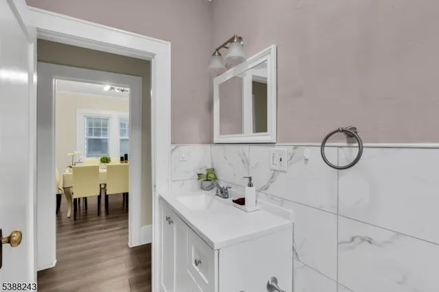 a view of a room with wooden floor and a window